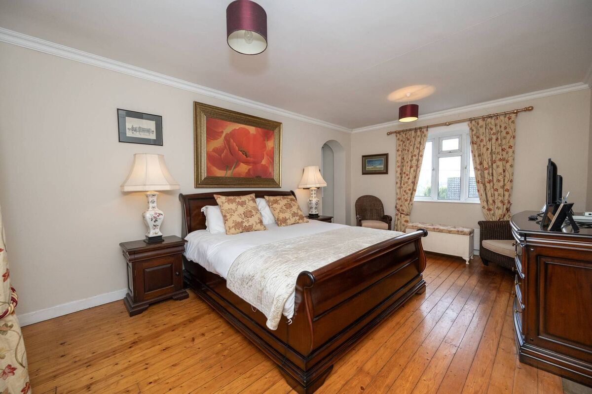 Main bedroom is dual aspect with walk-in dressing room and has a large en suite bathroom beyond