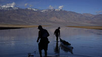 Kayakers paddle in one of Earth’s driest spots after rains replenish lake