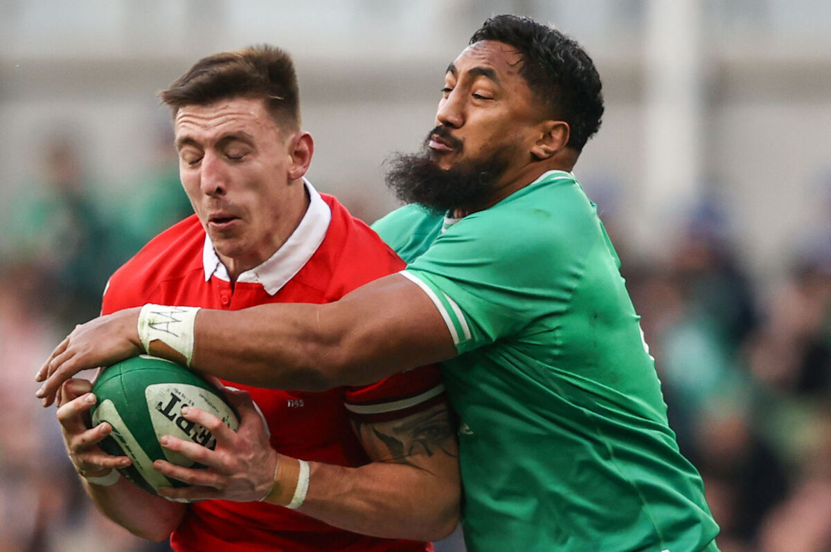 DEATH GRIP: Bundee Aki tackles Josh Adams.