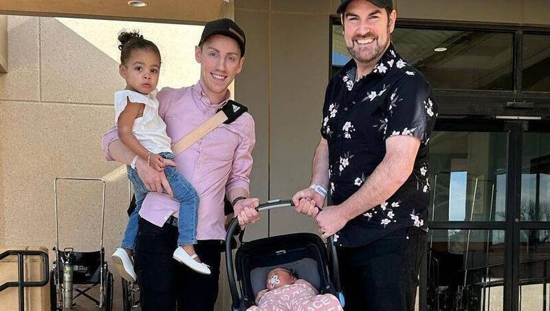 Mark, Eoin, and Aria leaving hospital with newborn Nala, who shares the same egg donor and surrogate as her older sister. Mark, Eoin, and Aria leaving hospital with newborn Nala, who shares the same egg donor and surrogate as her older sister.
