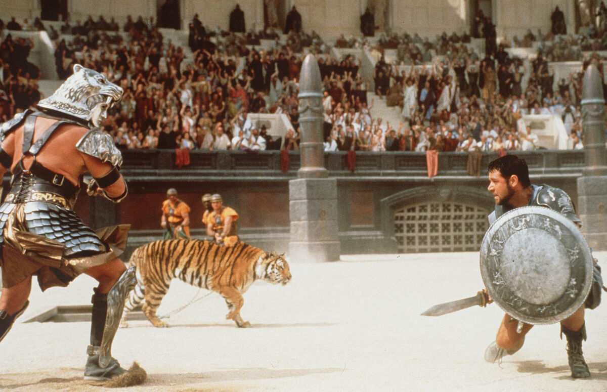 Russell Crowe (right) in the film Gladiator. The Romans used Barbary lions in the Colosseum to battle with gladiators. Thousands of lions and tigers were slaughtered during the reign of Caesar
