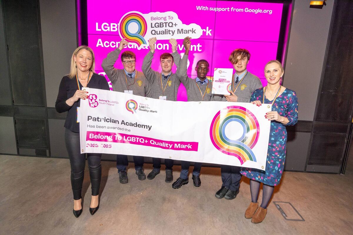 Staff and students of the Patrician Academy accepting their LGBTQ+ Quality Mark award on Friday