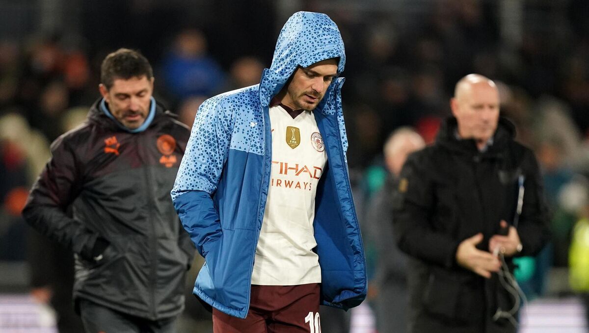 Manchester City’s Jack Grealish looks dejected as he walks across the pitch at half time after being substituted (Mike Egerton/PA)