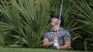 <p>Rory McIlroy hits from the rough on the eighth (Marta Lavandier/AP)</p>
