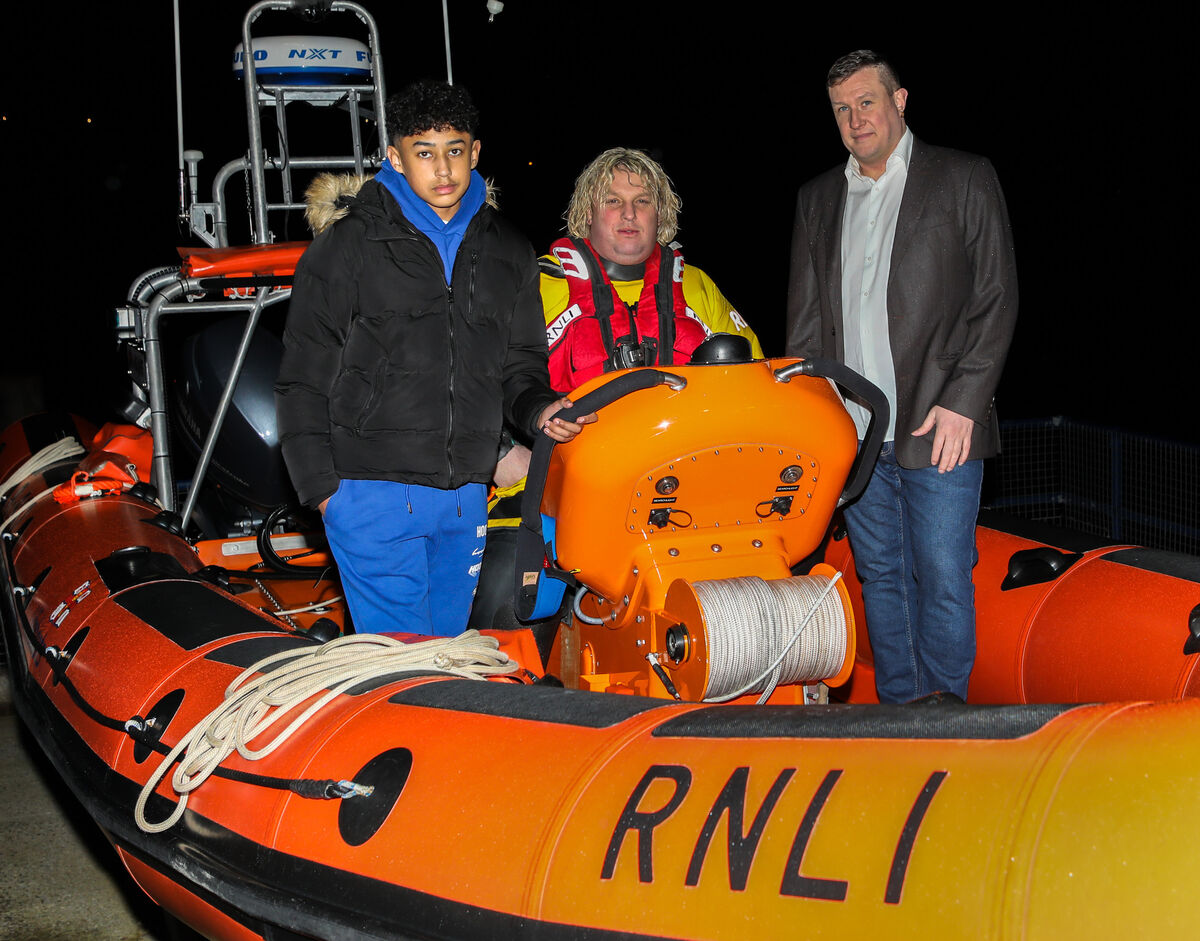 (Left to right) RNLI volunteer Paddy Quinlan at the helm of the Crosshaven lifeboat with Muruthi and Damien O'Donovan who he saved when they got into difficulties at Fountainstown, Co. Cork, on Thursday. Picture: David Creedon (Left to right) RNLI volunteer Paddy Quinlan at the helm of the Crosshaven lifeboat with Muruthi and Damien O'Donovan who he saved when they got into difficulties at Fountainstown, Co. Cork, on Thursday. Picture: David Creedon