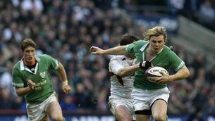 <p>BLONDE AMBITION: Brian O'Driscoll, supported by Ronan O'Gara, is tackled by England's Paul Grayson. Pic: INPHO/Billy Stickland</p>