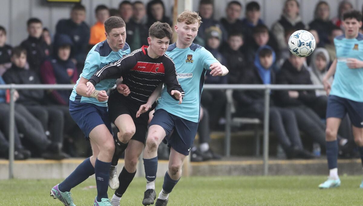  07/03/2024. FAI Schools Dr. Tony O'Neill Senior Munster Cup Final (Under 19, Large Schools) De La Salle College, Waterford vs St. Francis College, Rochestown at Ozier Park, Waterford City. Pictured are St. Francis College, Rochestown Darragh McCormack and De La Salle College, Waterford Sean Keane and Keelyn Waring. Photograph: Patrick Browne