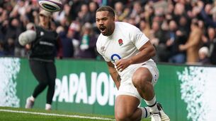 <p>DIGGING IN: England's Ollie Lawrence celebrates scoring their first try at Twickenham</p>