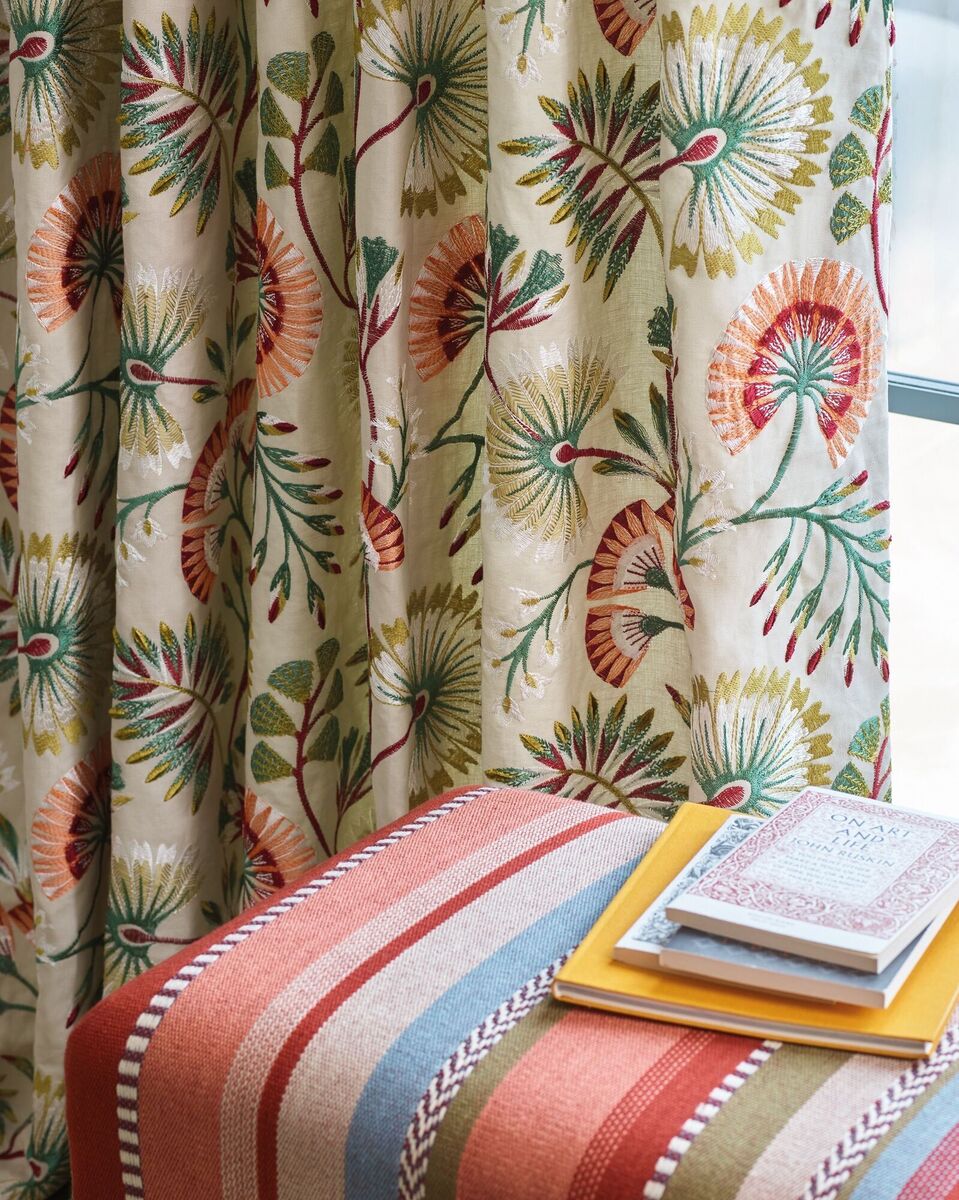  A modern take on floral embroidery in the Chiana red and green fabric by Jane Churchill makes it suitable for a period or contemporary sitting room.