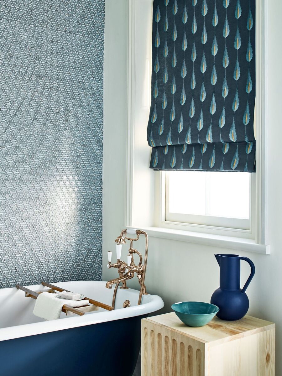  Blinds are practical, hygienic and space saving in bathrooms which are often the smallest room in the home. Plato Midnight Gold fabric by Jane Churchill adds softness and texture with style.
