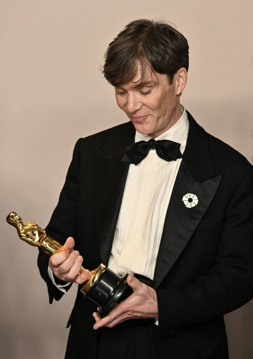 Cillian Murphy looks at his Oscar while posing for photos in the press room after winning the Oscar for Best Actor in a Leading Role during the 96th Annual Academy Awards. Picture: Photo by ROBYN BECK/AFP via Getty Images