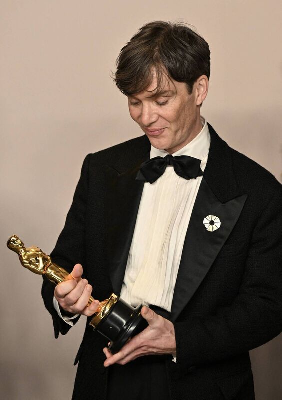 Cillian Murphy looks at his Oscar while posing for photos in the press room after winning the Oscar for Best Actor in a Leading Role during the 96th Annual Academy Awards. Picture: Photo by ROBYN BECK/AFP via Getty Images