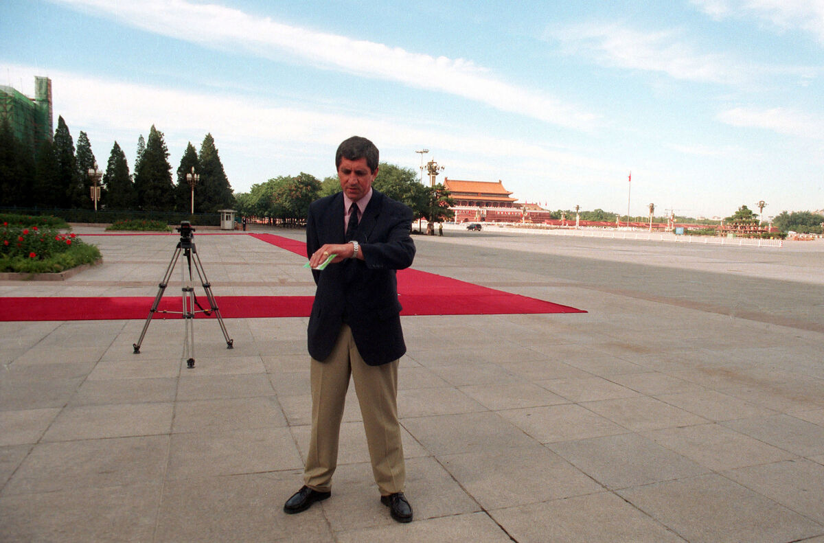 Charlie Bird checks the time at Tiananmen Square in Beijing, China in 1998 Picture: Eamonn Farrell/RollingNews.ie Charlie Bird checks the time at Tiananmen Square in Beijing, China in 1998 Picture: Eamonn Farrell/RollingNews.ie