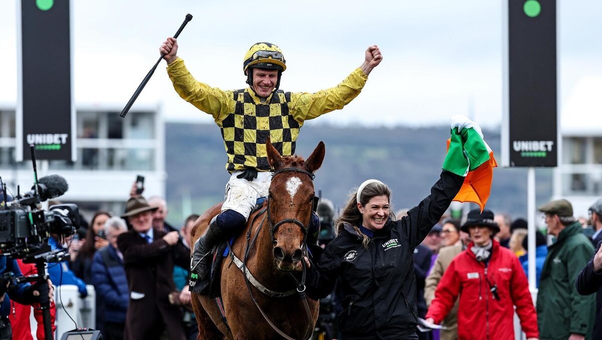 Groom Rachael Robbins and jockey Paul Townend celebrate after winning the Champion Hurdle at Cheltenham with State Man. Picture: ©INPHO/Tom Maher