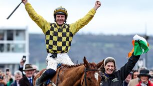 <p>The Champion Hurdle groom Rachael Robbins and jockey Paul Townend celebrate after winning with State Man. Picture: ©INPHO/Tom Maher</p>