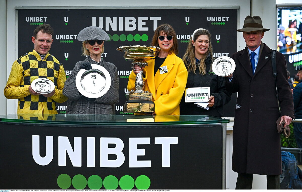 Trainer Willie Mullins, right, and jockey Paul Townened celebrate with winning connections, including Cork owner Marie Donnelly, after victory in the Champion Hurdle at Cheltenham with State Man. Photo by Harry Murphy/Sportsfile