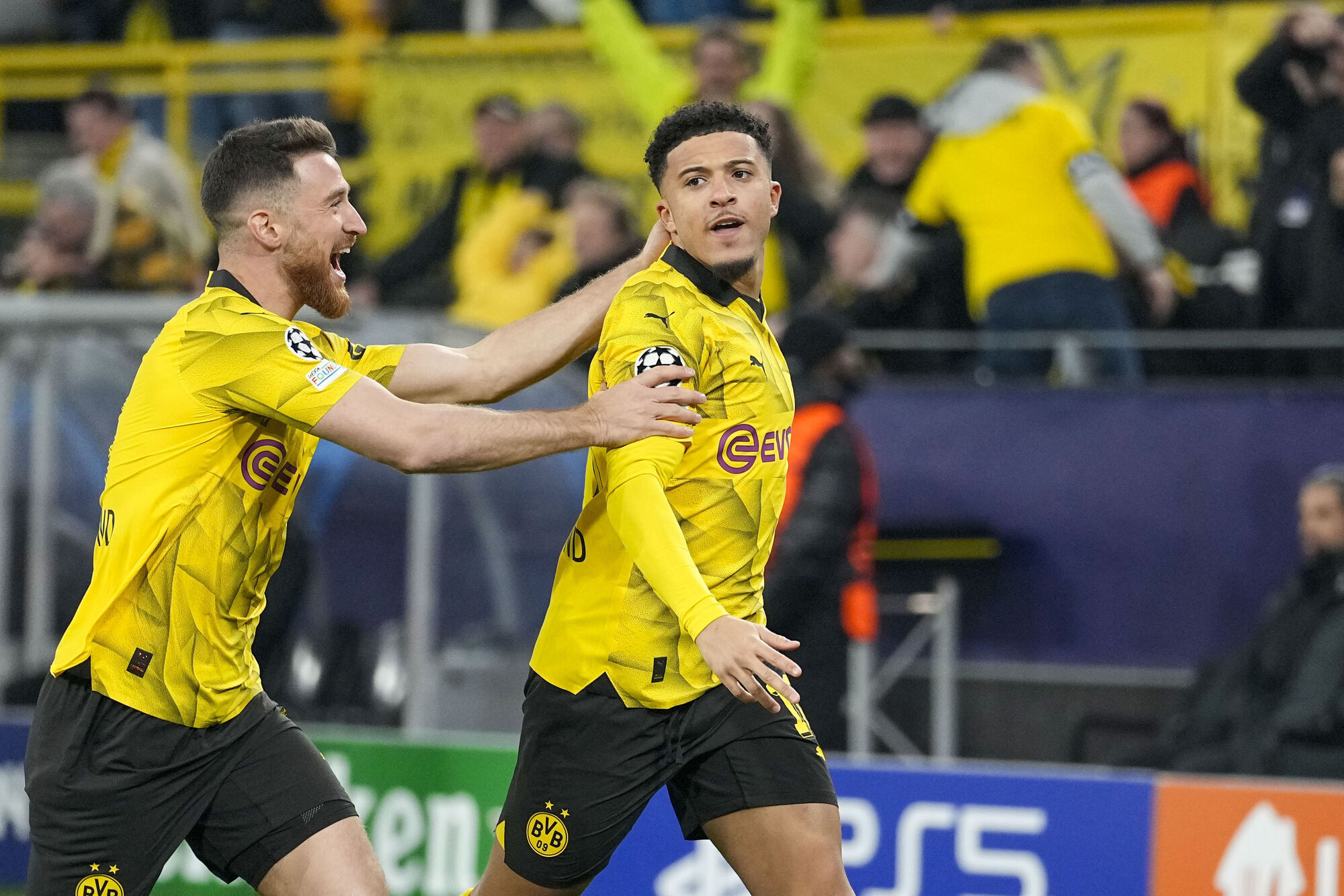 Sancho and Reus fire Dortmund into last eight