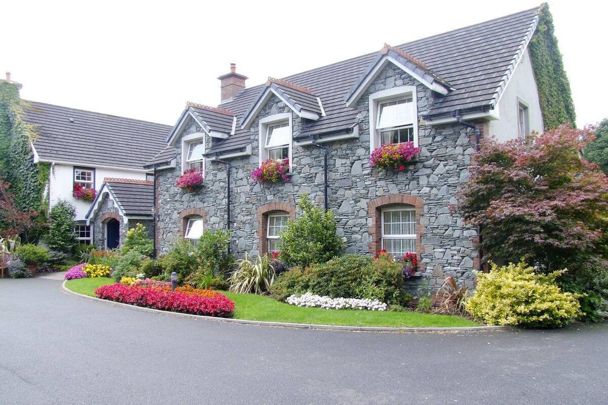 Trad look to high-end ten-bed guesthouse with three-bed owner's house and staff quarters