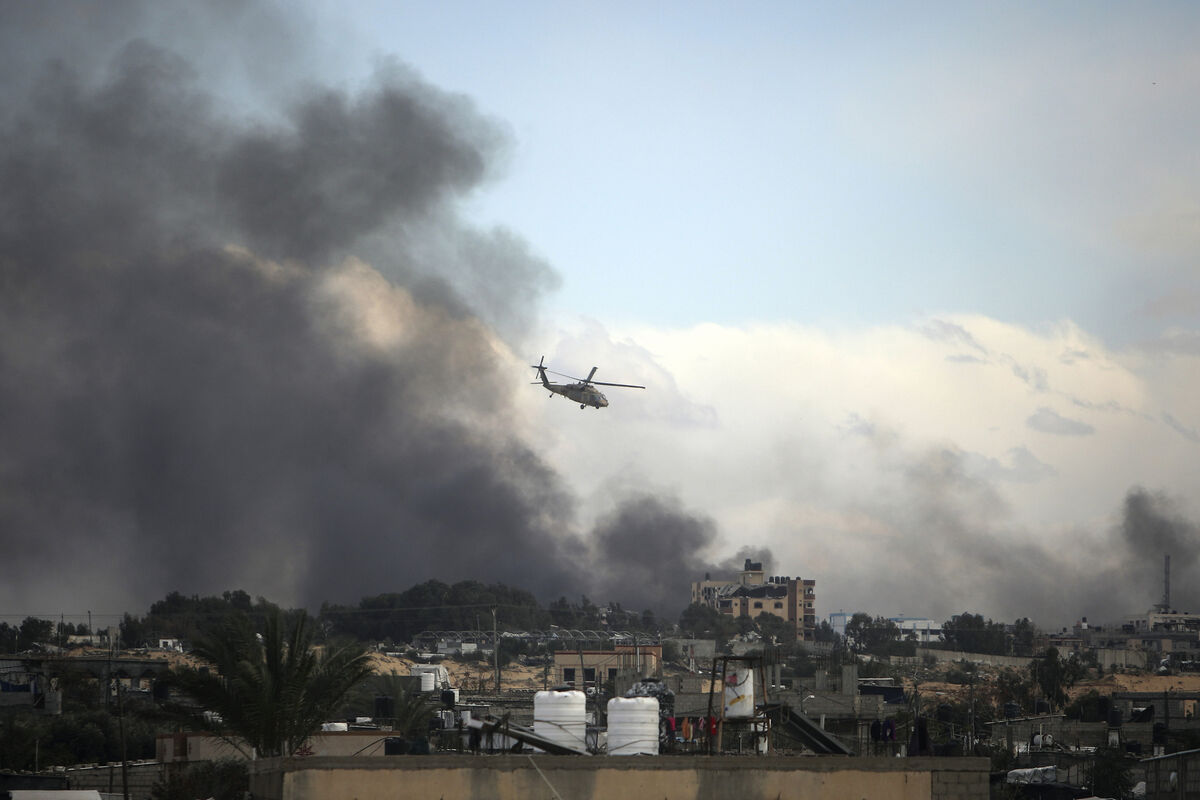 An Israeli helicopter flies over Khan Younis in Gaza. Picture: AP Photo/Mohammed Dahman An Israeli helicopter flies over Khan Younis in Gaza. Picture: AP Photo/Mohammed Dahman