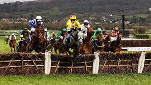 <p>Harry Skelton onboard L’eau Du Sud and Paul Townsend onboard Absurde come over the final hurdle. Picture: ©INPHO/Tom Maher</p>