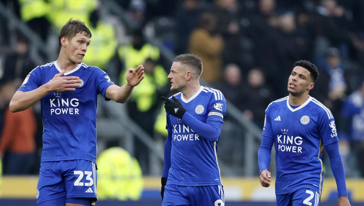 Leicester City's Jannik Vestergaard (left) speaks with Jamie Vardy (centre) and James Justin (right).