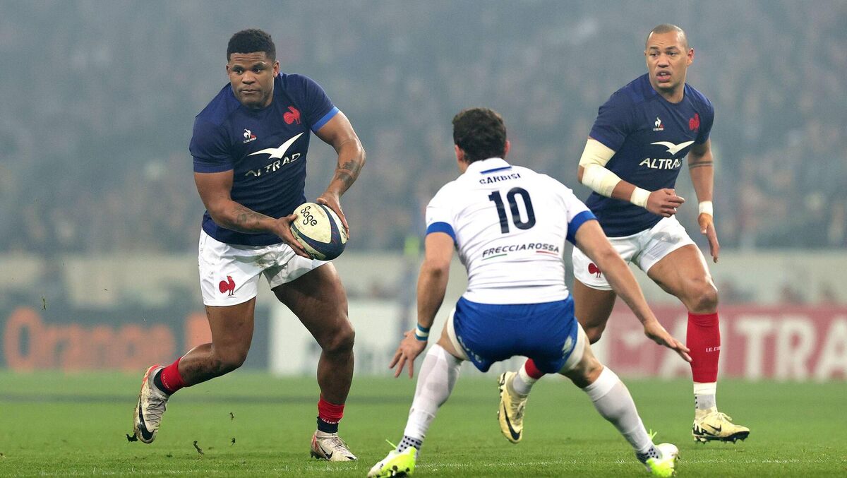 Jonathan Danty of France looks to pass the ball as Italy's Paolo Garbisi looks on during the Six Nations. Jonathan Danty of France looks to pass the ball as Italy's Paolo Garbisi looks on during the Six Nations.