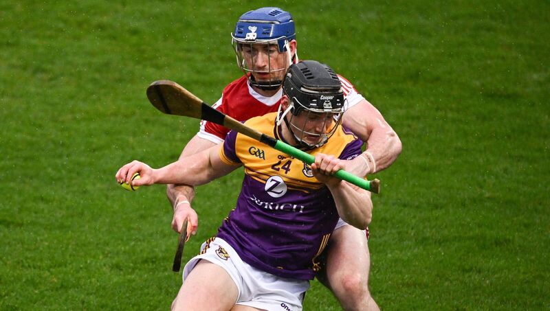 Mikie Mahony of Wexford is tackled by Sean O'Donoghue of Cork. Photo by Ray McManus/Sportsfile Mikie Mahony of Wexford is tackled by Sean O'Donoghue of Cork. Photo by Ray McManus/Sportsfile