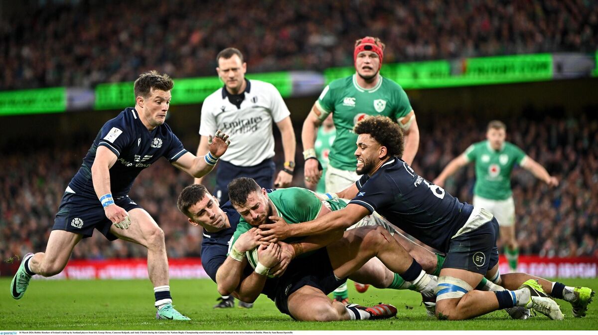 Robbie Henshaw of Ireland is held up by Scotland players from left, George Horne, Cameron Redpath, and Andy Christie during the Guinness Six Nations Rugby Championship match between Ireland and Scotland at the Aviva Stadium in Dublin. Photo by Sam Barnes/Sportsfile