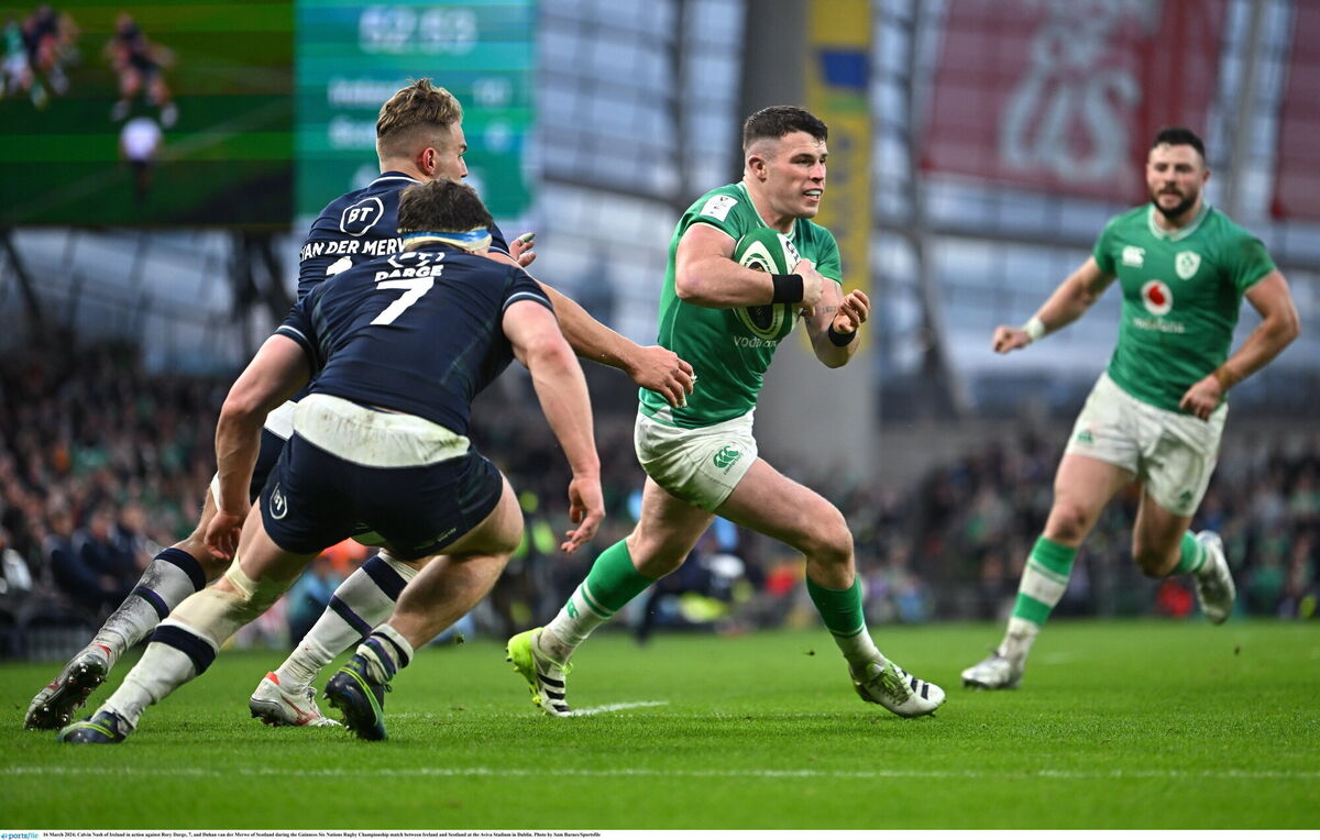 Calvin Nash of Ireland in action against Rory Darge, 7, and Duhan van der Merwe of Scotland  Photo by Sam Barnes/Sportsfile