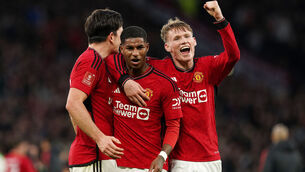 <p>Manchester United's Marcus Rashford and team-mates Scott McTominay and Harry Maguire celebrate after the full-time whistle. Pic: Martin Rickett/PA Wire</p>