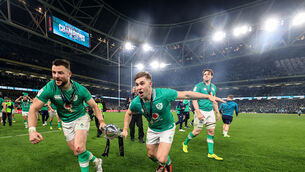 <p>SIGNED, SEALED, DELIVERED: Ireland’s Robbie Henshaw and Jack Crowley celebrate with the trophy. Pic: Dan Sheridan, Inpho</p>