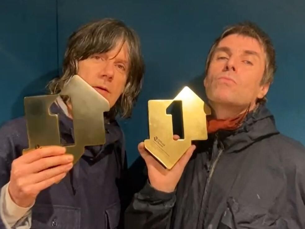 John Squire and Liam Gallagher marking the rise of their debut album to the top of the UK charts. Picture: Official Charts Company//PA Wire John Squire and Liam Gallagher marking the rise of their debut album to the top of the UK charts. Picture: Official Charts Company//PA Wire