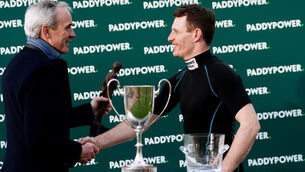 <p>SEAMLESS TRANSITION: Ruby Walsh, left, presents Paul Townend with the leading jockey trophy at last week's Cheltenham Festival. 	Picture: David Davies/PA </p>