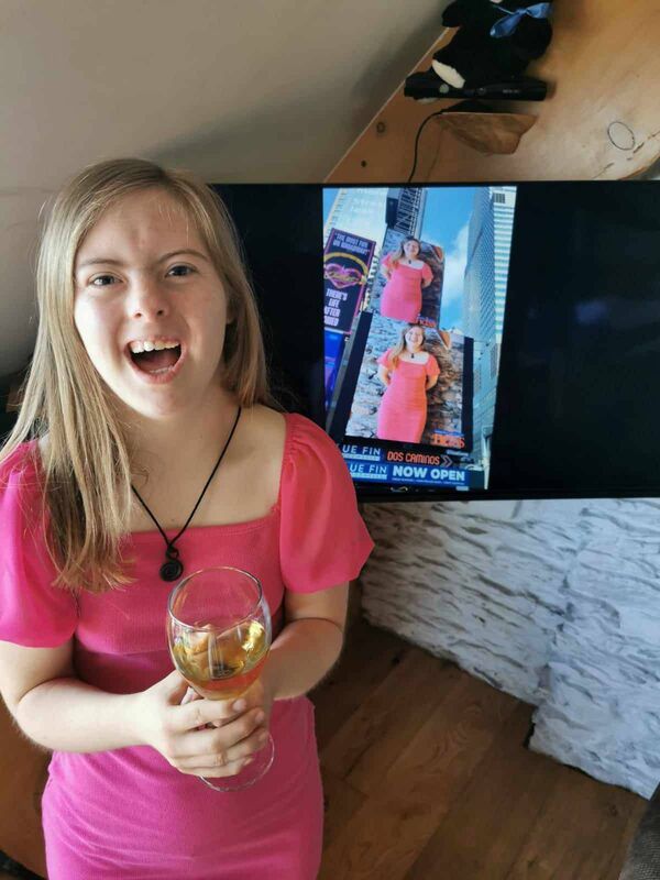 Jessie Waschkowitz with an image of her billboard in Times Square. Jessie Waschkowitz with an image of her billboard in Times Square.