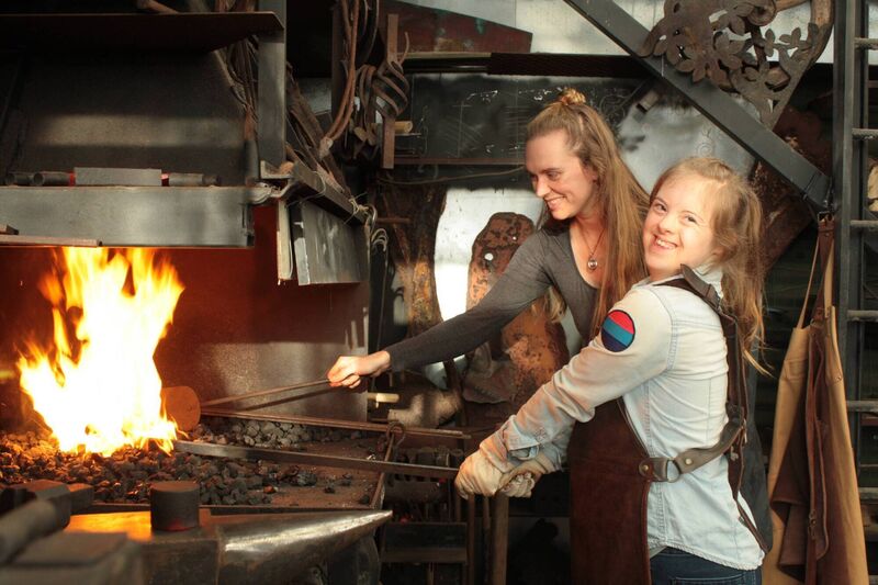 Jessie Waschkowitz working in the forge in her home with her Born Transcendent colleague, Suki Blochinger. Jessie Waschkowitz working in the forge in her home with her Born Transcendent colleague, Suki Blochinger.