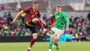 <p>Belgium's Timothy Castagne (left) and Republic of Ireland's Evan Ferguson battle for the ball.</p>