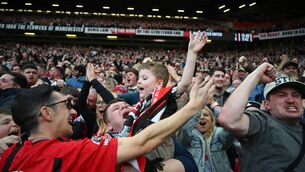 <p>Manchester United fans celebrate during the Emirates FA Cup Quarter Final against Liverpool. Pic: Michael Regan/Getty Images</p>