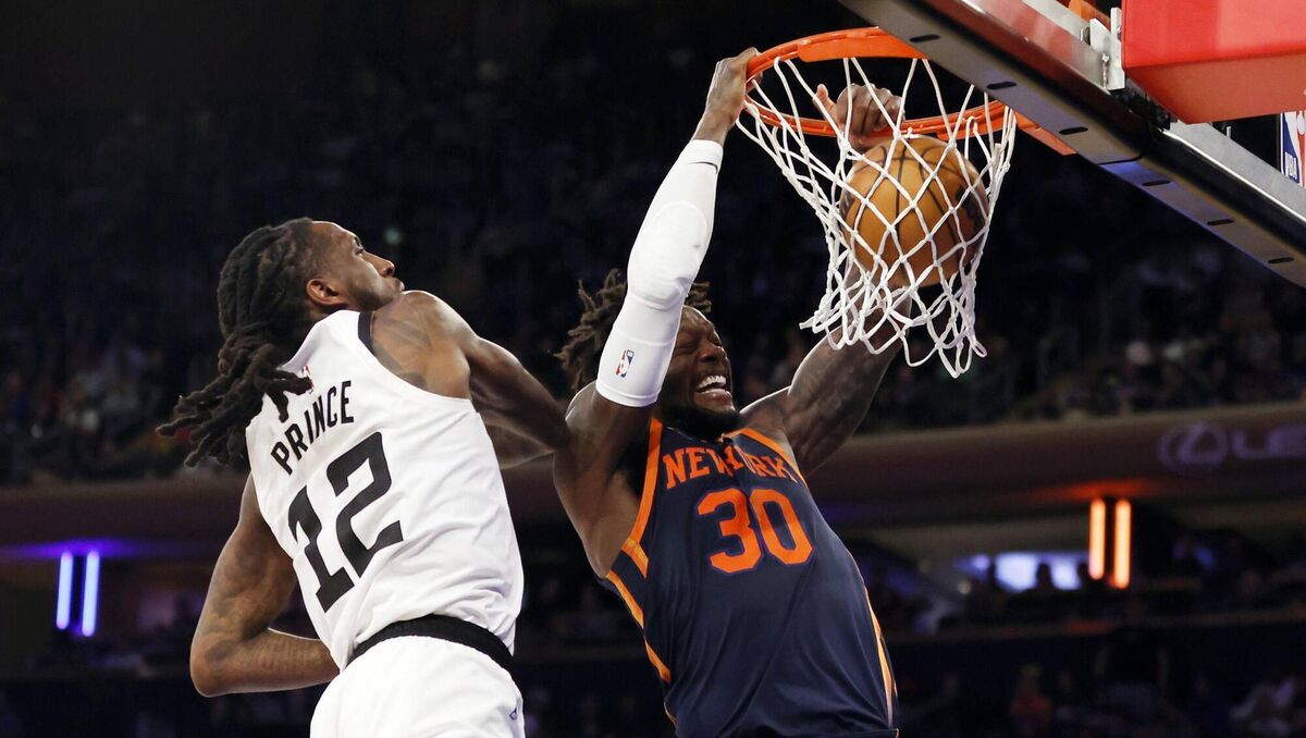 Julius Randle of the New York Knicks dunks the ball.