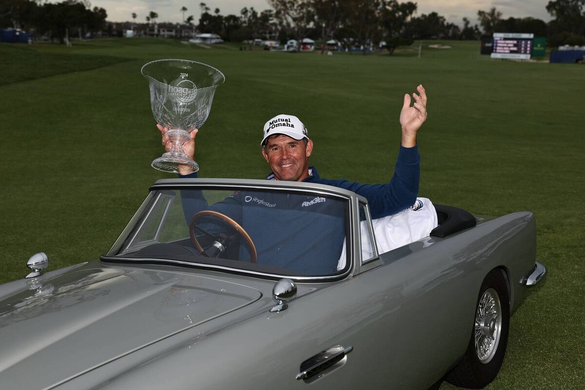 Padraig Harrington with the winner's trophy in a miniature Aston Martin at the Hoag Classic at Newport Beach. Picture: Michael Owens/Getty Images Padraig Harrington with the winner's trophy in a miniature Aston Martin at the Hoag Classic at Newport Beach. Picture: Michael Owens/Getty Images