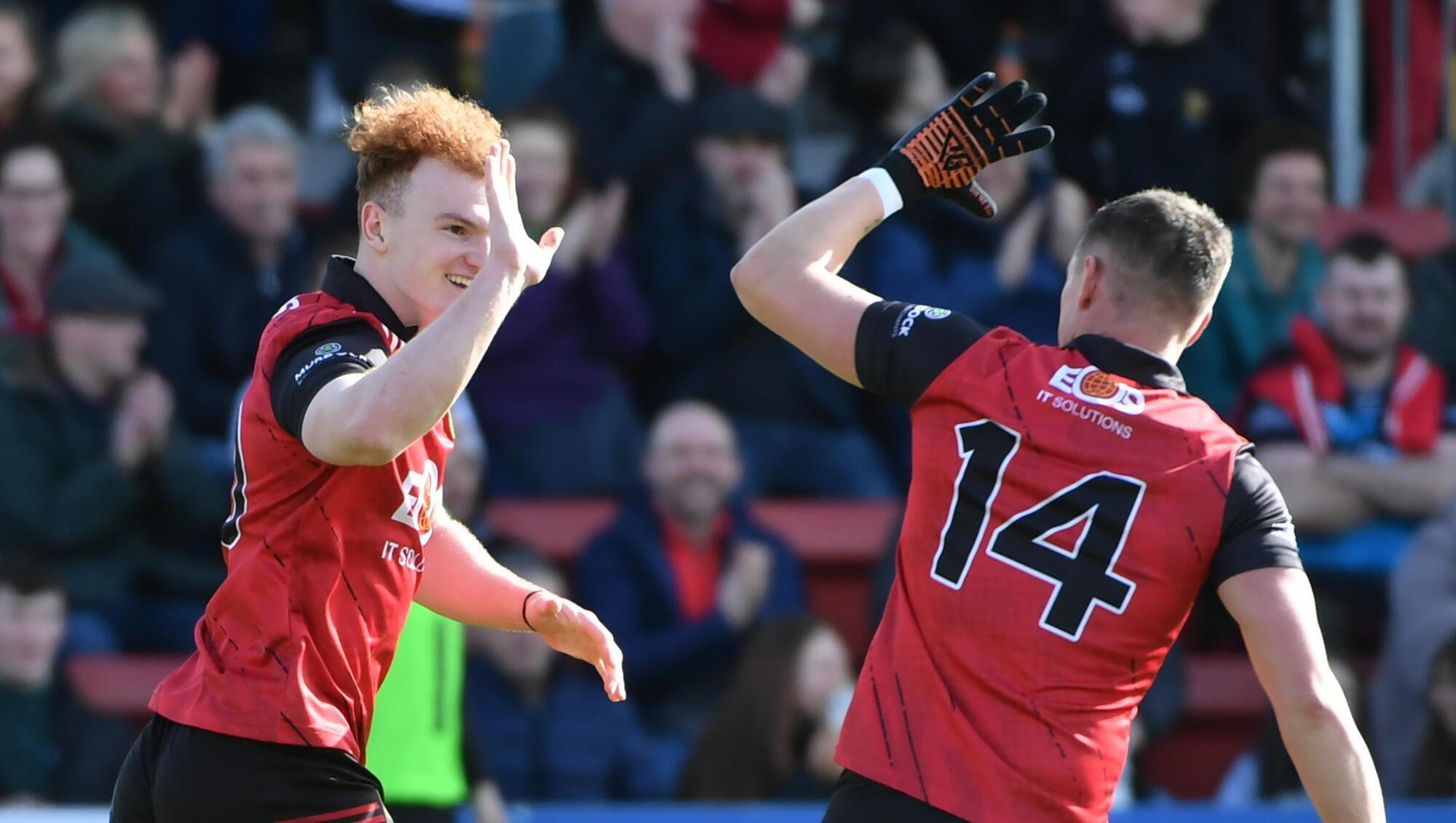 DOWN TOWN: Danny Magill of Down celebrates with Pat Havern after he scored a goal. Pic Credit: Andrew Paton, Inpho.