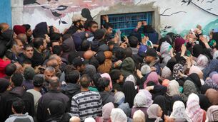 <p>Palestinian people seeking food at an UNRWA warehouse on Monday, March 18, as Gaza residents face a hunger crisis amid the bombardment by Israel. Picture: Mahmoud Issa/Reuters</p>
