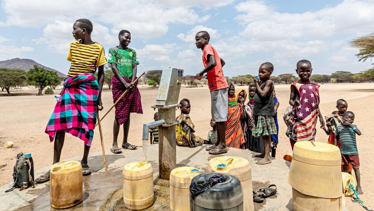 Children pump water at a tap in Kangalita,  a region in Kenya  that has been severely affected by drought. 