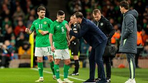 <p>Ireland interim manager John O'Shea speaks with Josh Cullen.  Picture: ©INPHO/Ryan Byrne</p>