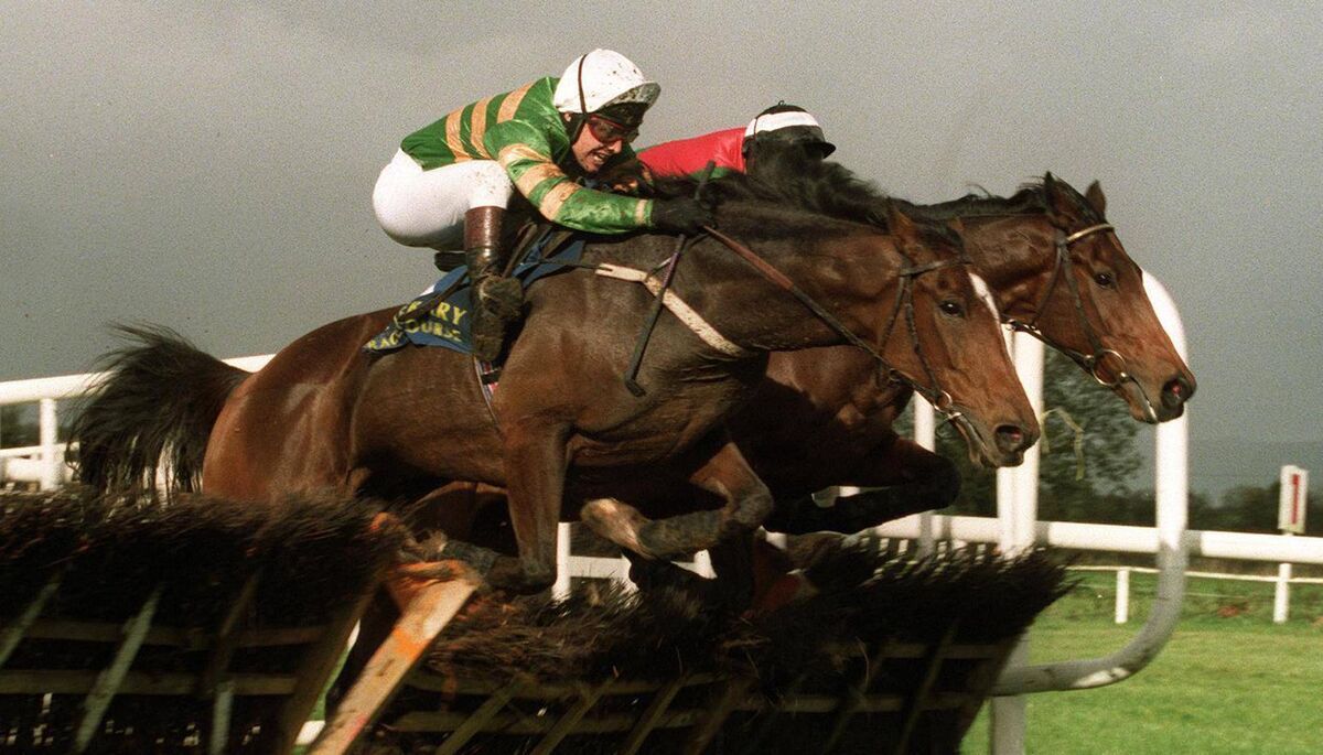 The John James Memorial Hurdle in 1999: Istabraq ridden by Charlie Swan comes over the last from Limestone Lad ridden by Paul Carberry Picture: INPHO/Billy Stickland