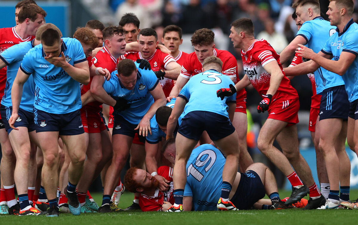 Derry’s Conor Glass clashes with Paddy Small of Dublin
