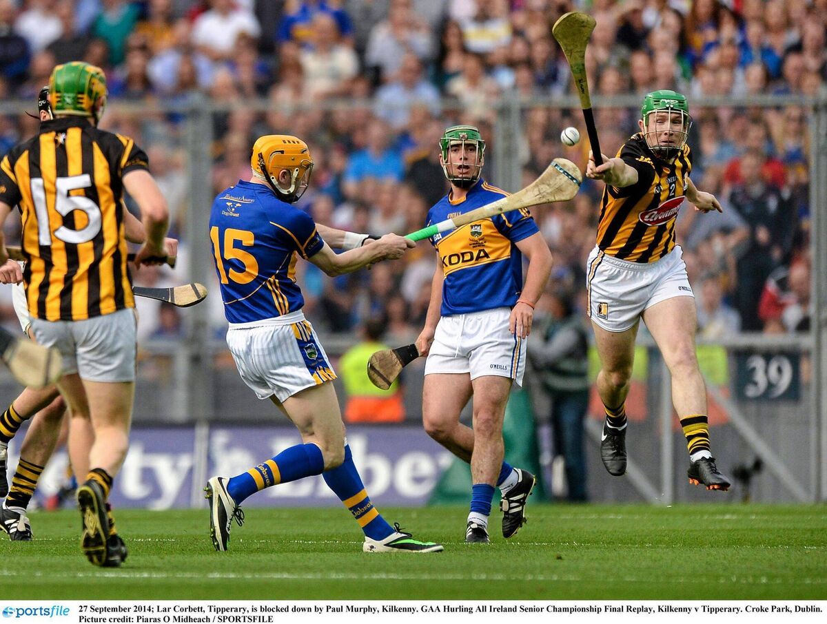 Lar Corbett, Tipperary, is blocked down by Paul Murphy, Kilkenny during the 2014 All-Ireland hurling final replay. Picture credit: Piaras Ó Mídheach / SPORTSFILE