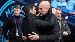 <p>EMBRACEABLE YOU: Manchester City manager Pep Guardiola and Arsenal manager Mikel Arteta speak. Pic: Martin Rickett/PA Wire.</p>