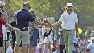 <p>FLYING VISIT: Tommy Fleetwood, of England, slaps hands with members of the gallery as he walks to the 12th tee during the second round of The Players Championship. Pic: Lynne Sladky, AP</p>