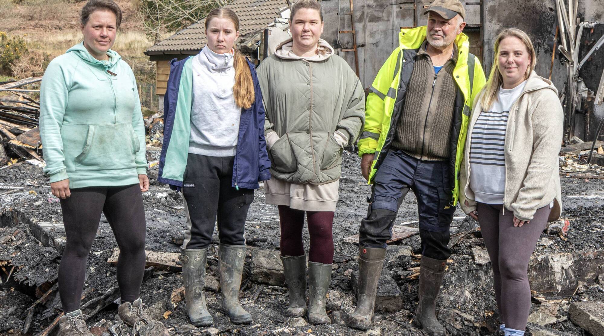 (Left to right) Pieter Bot's daughter Wendy Donnelly, granddaughter Lily-Mae Donnelly, daughter Lonneke Bot, Pieter Bot and daughter Linde Bot Hutchinson at the site of the home he lost in a blaze in Behihane, Castlecove. Picture: Michael Donnelly