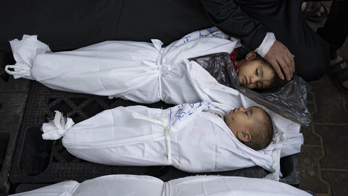 Ashraf Abu Draz's daughters who were killed in Gaza in an Israeli bombardment this week. Colin Sheridan writes that we 'can’t unsee the images of dead babies, made motherless long before their short lives are ended'. Picture: Fatima Shbair/AP Ashraf Abu Draz's daughters who were killed in Gaza in an Israeli bombardment this week. Colin Sheridan writes that we 'can’t unsee the images of dead babies, made motherless long before their short lives are ended'. Picture: Fatima Shbair/AP